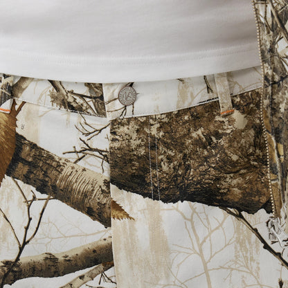 The Male model is wearing  New Era Earthy Skin Real Tree Snow Oversized Shorts 5