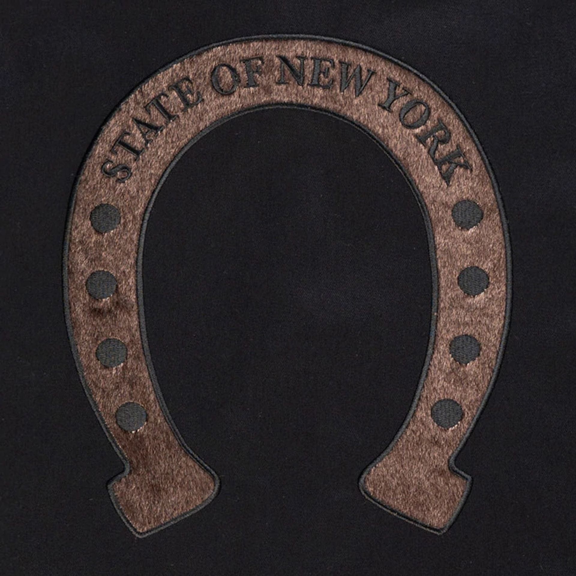 The model is wearing this New Era Year Of The Horse Jacket in black. 3