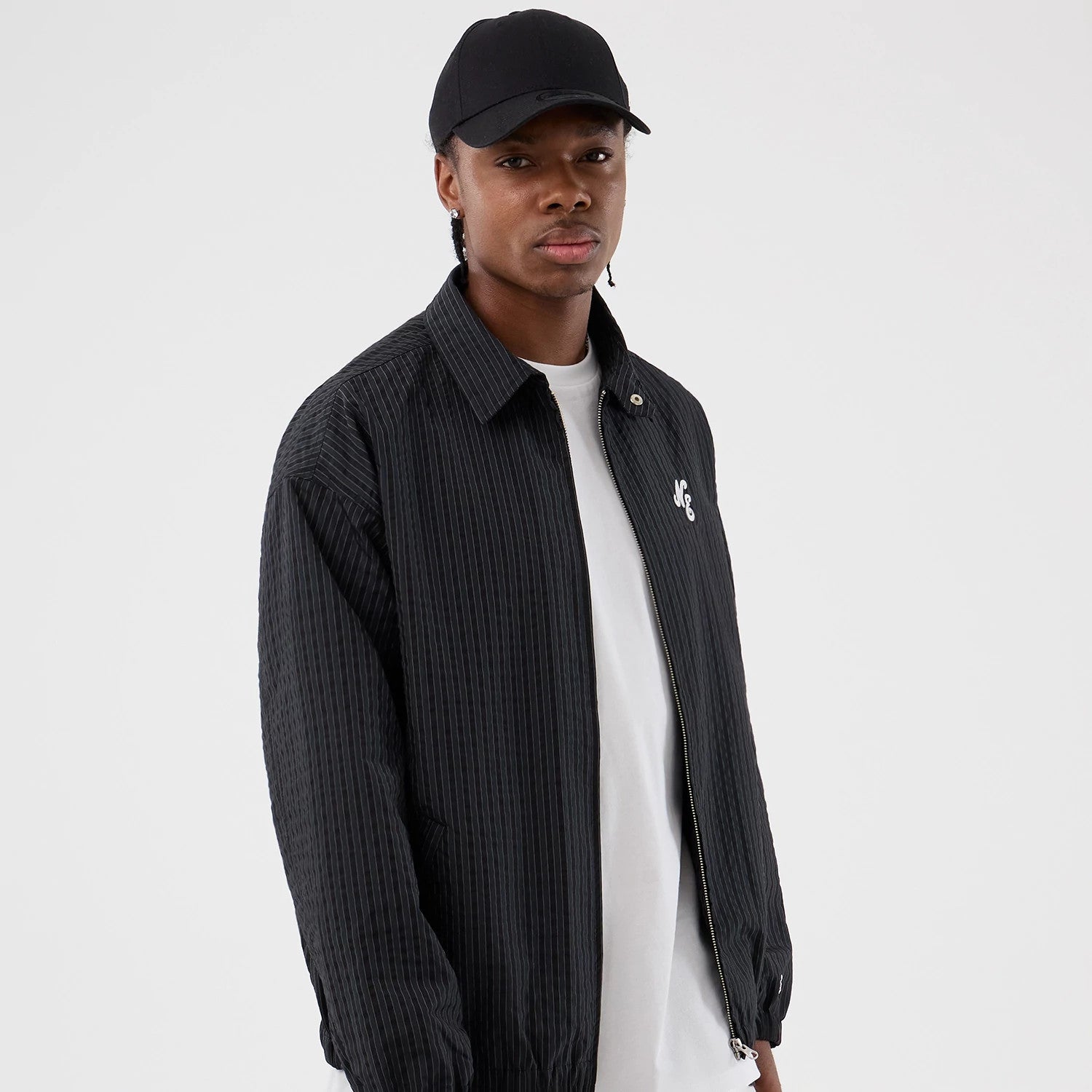 The model is wearing this New Era Street Class jacket in navy. 1