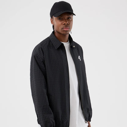 The model is wearing this New Era Street Class jacket in navy. 1