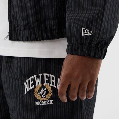 The model is wearing this New Era Street Class jacket in navy. 6