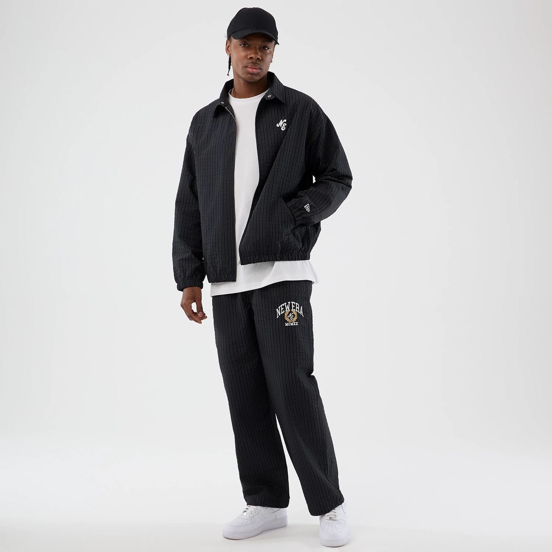 The model is wearing this New Era Street Class jacket in navy. 8