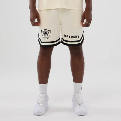 The model is wearing these NFL Historic Las Vegas Raiders shorts in cream. 1
