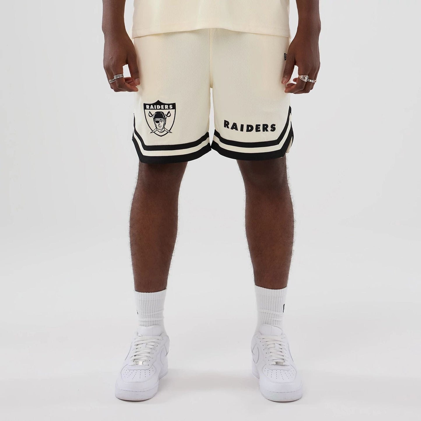 The model is wearing these NFL Historic Las Vegas Raiders shorts in cream. 1