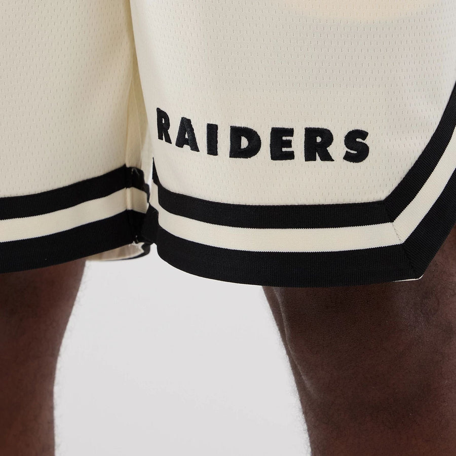The model is wearing these NFL Historic Las Vegas Raiders shorts in cream. 3