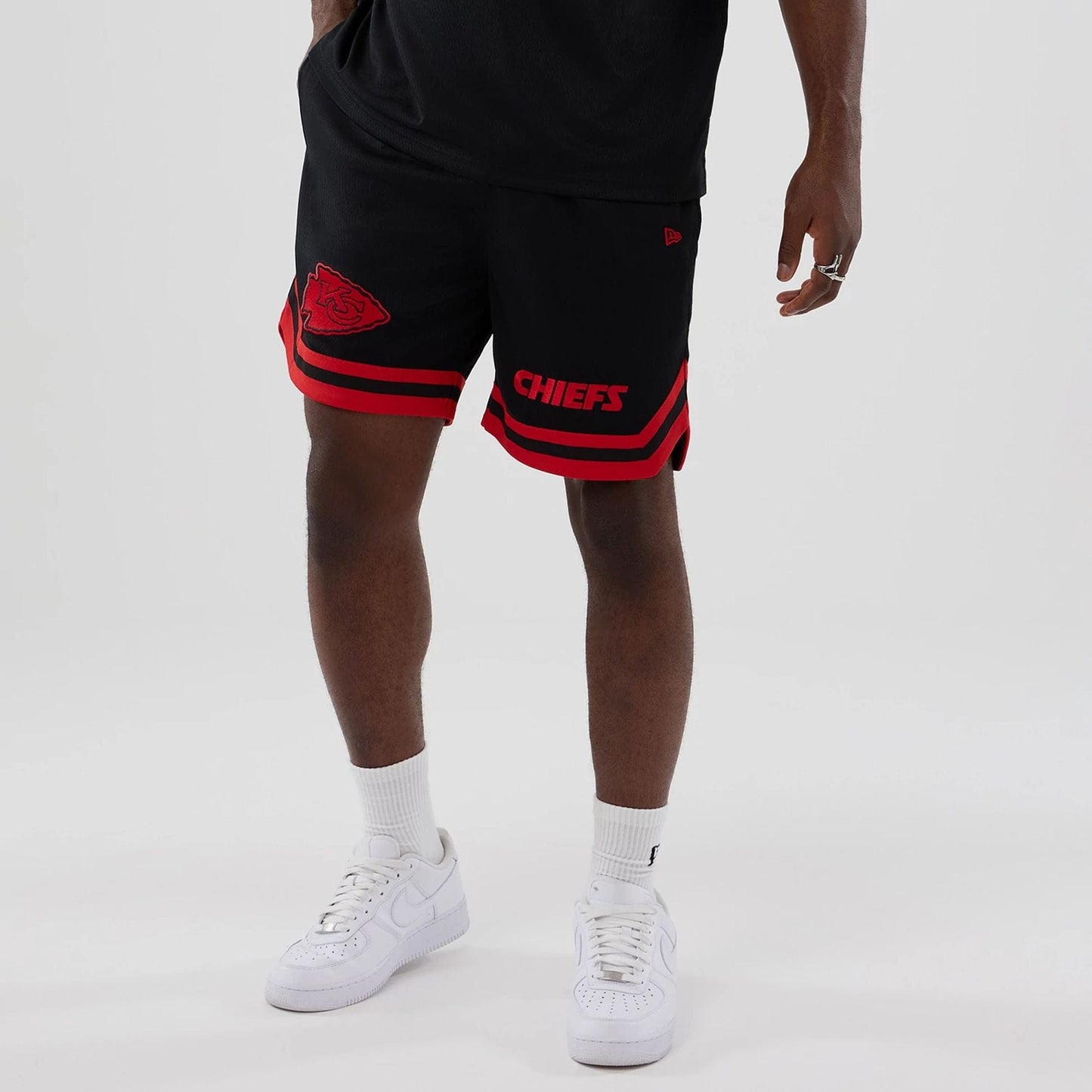 The model is wearing these NFL Historic Kansas City Chiefs shorts in black. 7
