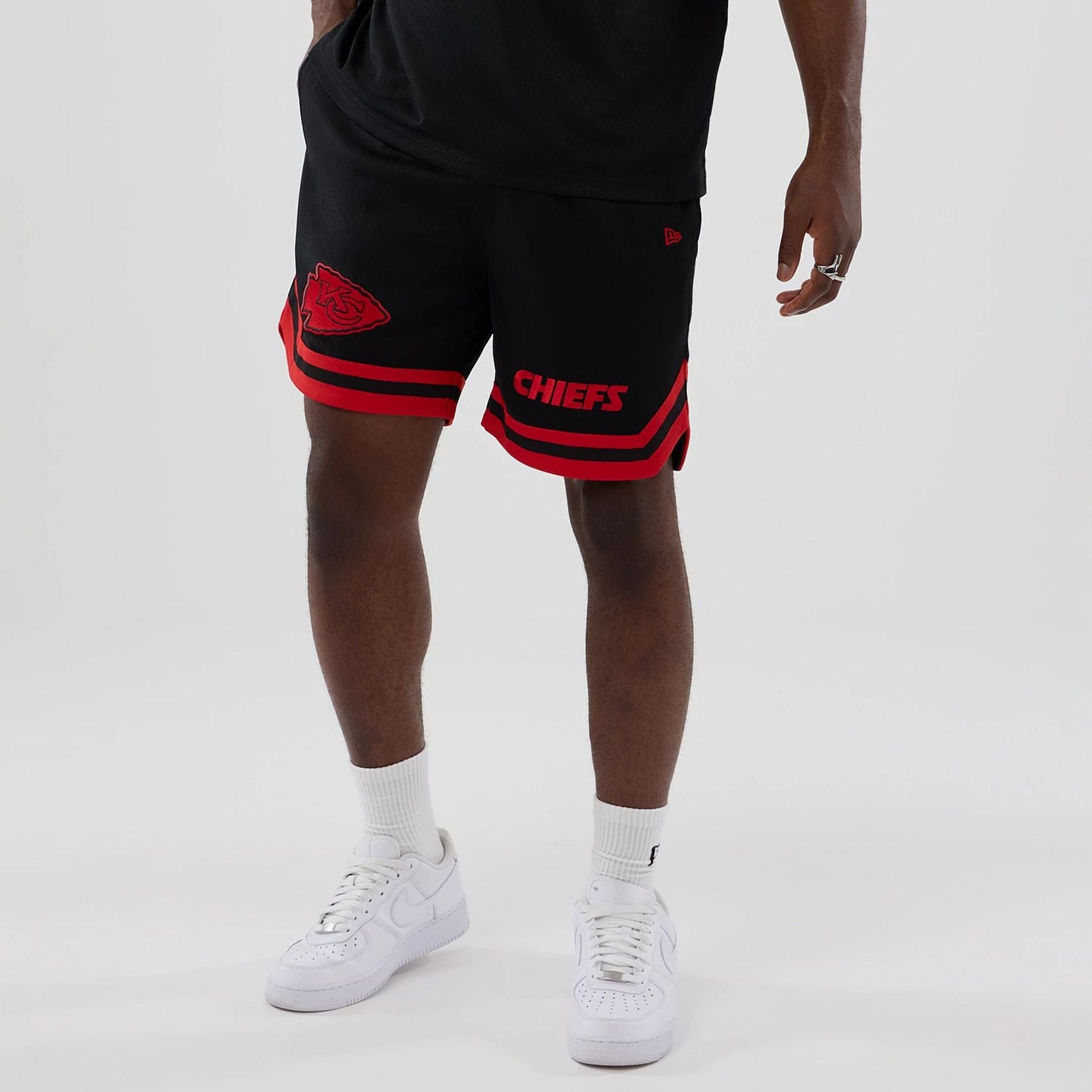 The model is wearing these NFL Historic Kansas City Chiefs shorts in black. 7