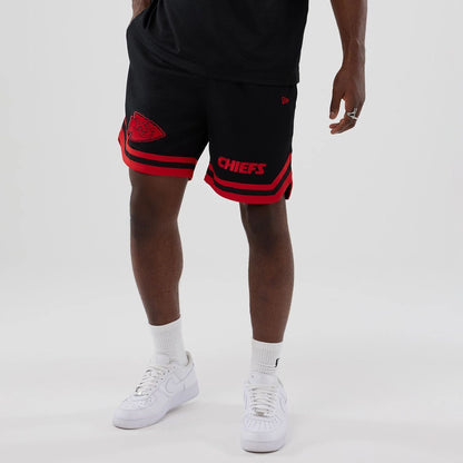 The model is wearing these NFL Historic Kansas City Chiefs shorts in black. 7