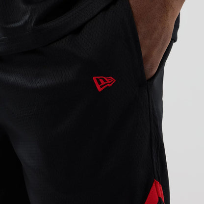 The model is wearing these NFL Historic Kansas City Chiefs shorts in black. 5