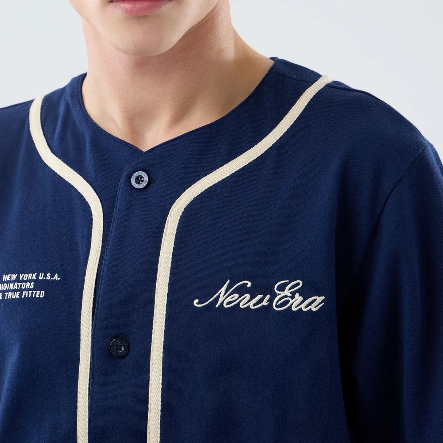 The model is wearing this New Era Oceanside Jersey in blue. 7