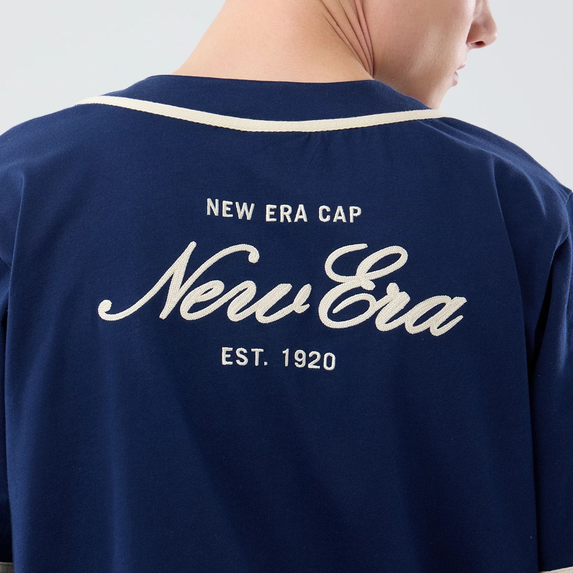 The model is wearing this New Era Oceanside Jersey in blue. 6