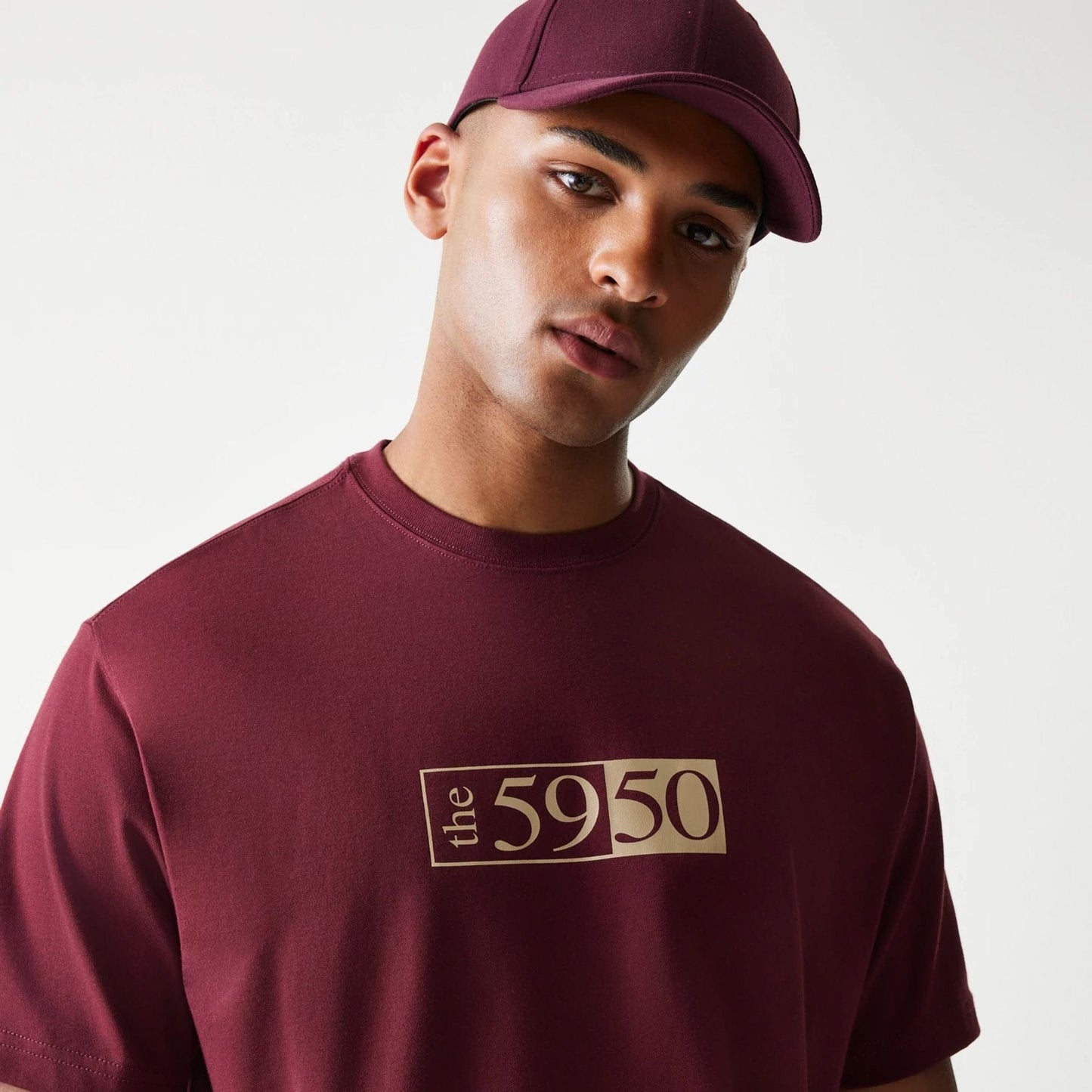 The Male model is wearing A-Frame 59FIFTY Fitted Cap Description Dark Red T-Shirt 4