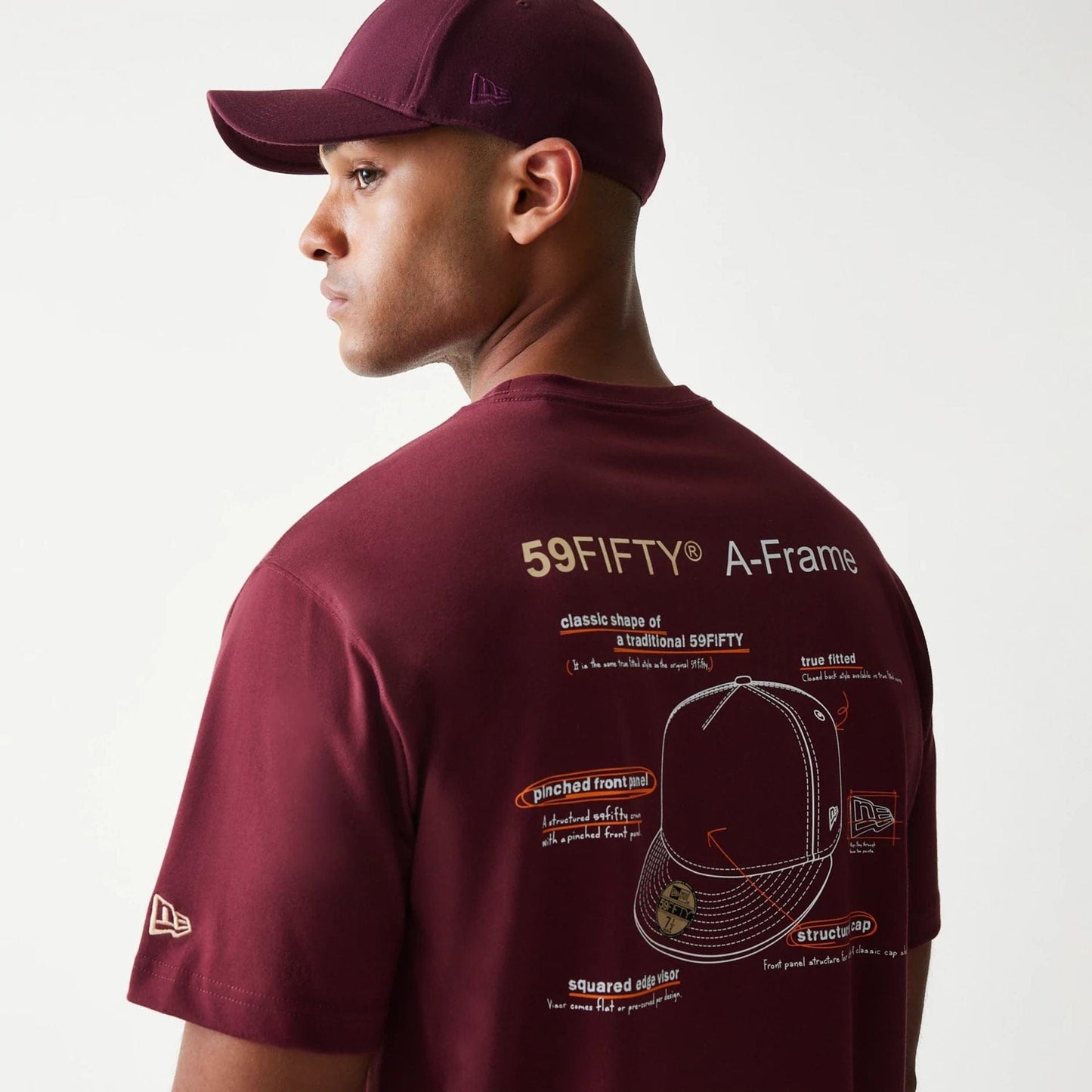 The Male model is wearing A-Frame 59FIFTY Fitted Cap Description Dark Red T-Shirt 5