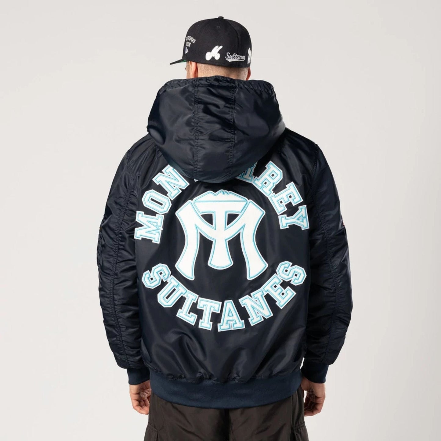 The Male model is wearing Sultanes De Monterrey LMB X Alpha Navy Jacket 2