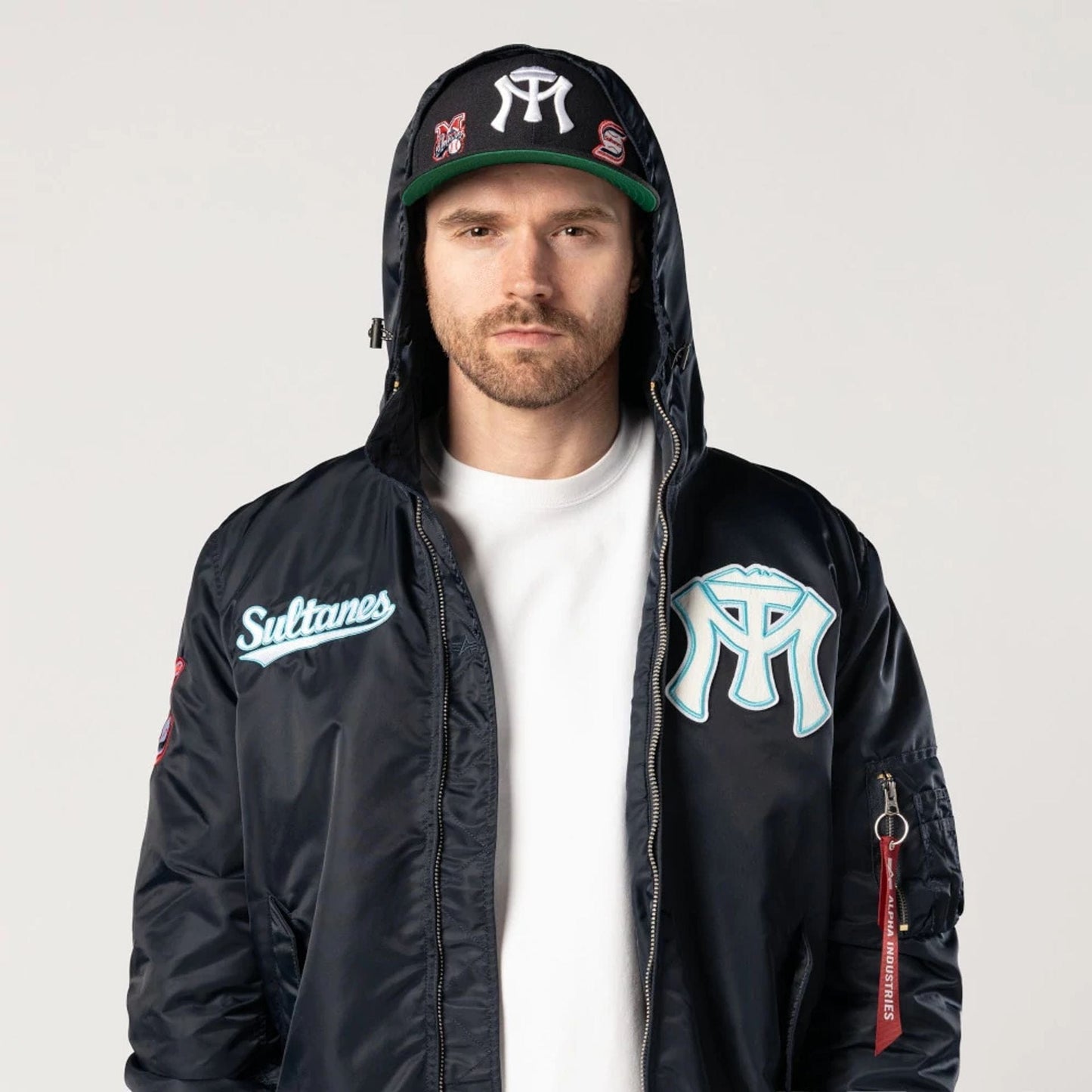 The Male model is wearing Sultanes De Monterrey LMB X Alpha Navy Jacket 5