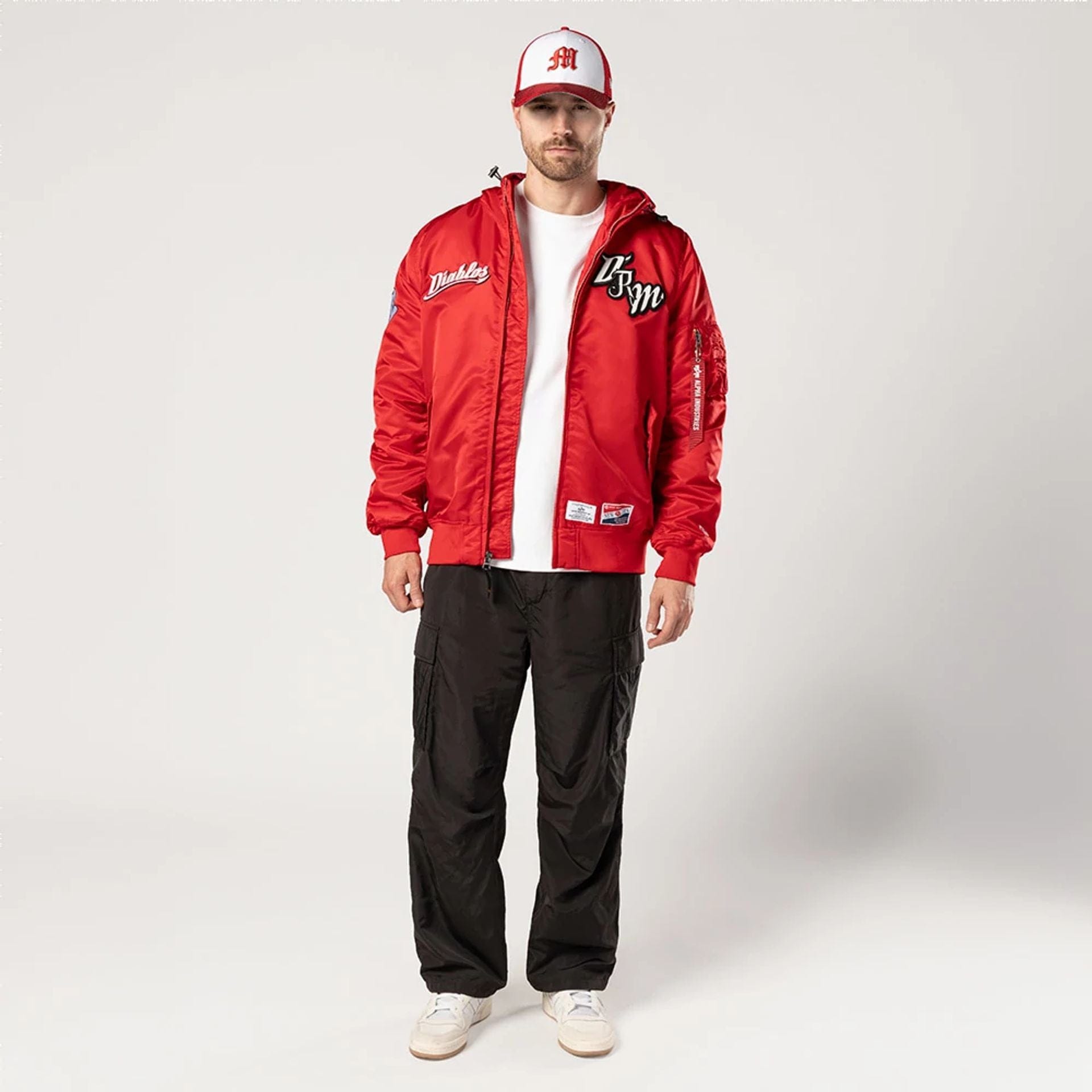 The Male model is wearing Mexico Diablos LMB X Alpha Red Jacket 7