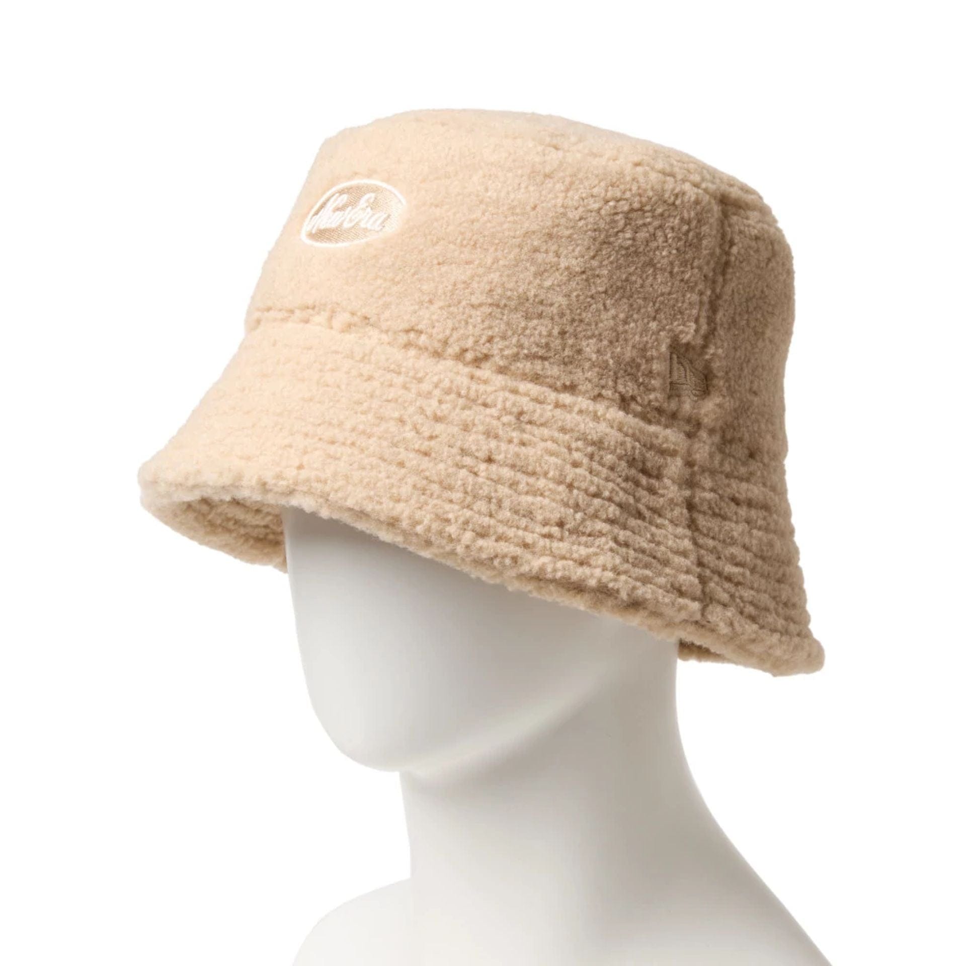 This is a  New Era Oval Logo Boa Beige Bucket Hat 3