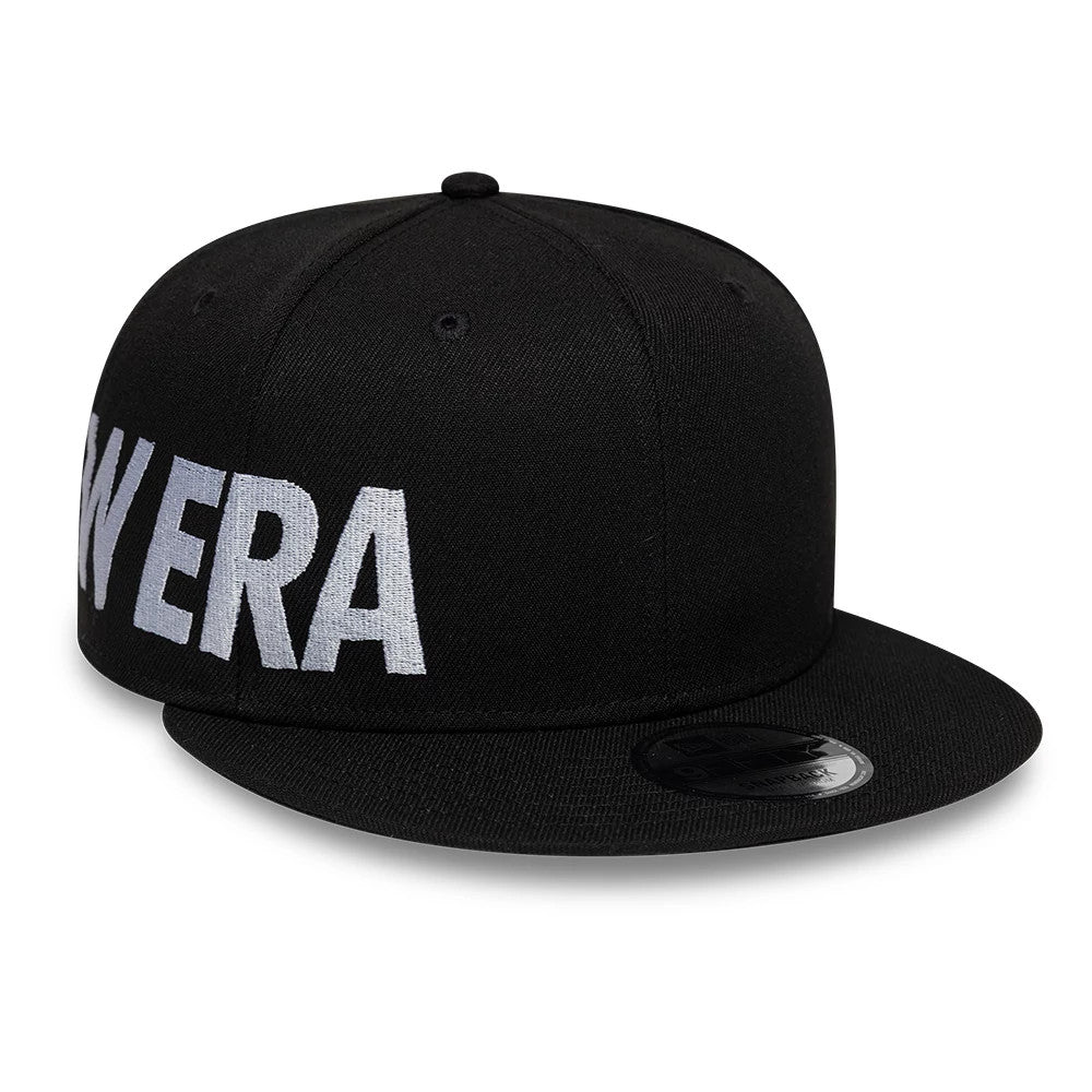 Pictured is this New Era Essential 9FIFTY Snapback cap in black. 1