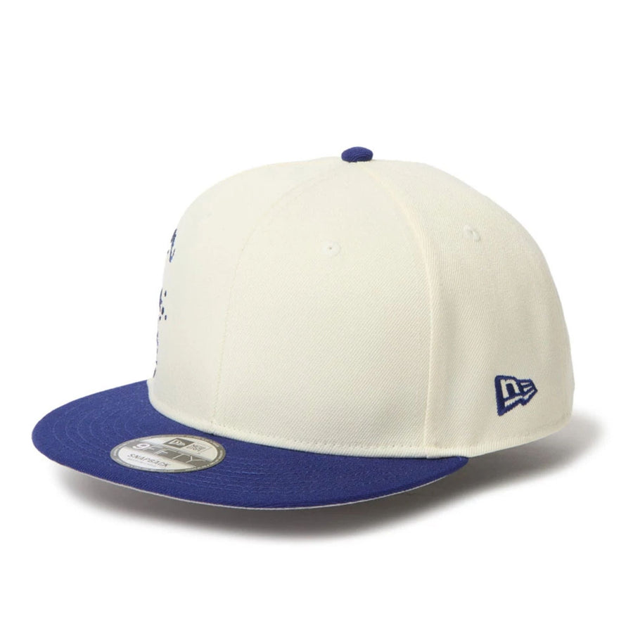 This is a New Era Dripping Emblem Cream 9FIFTY Snapback Adjustable Cap 3