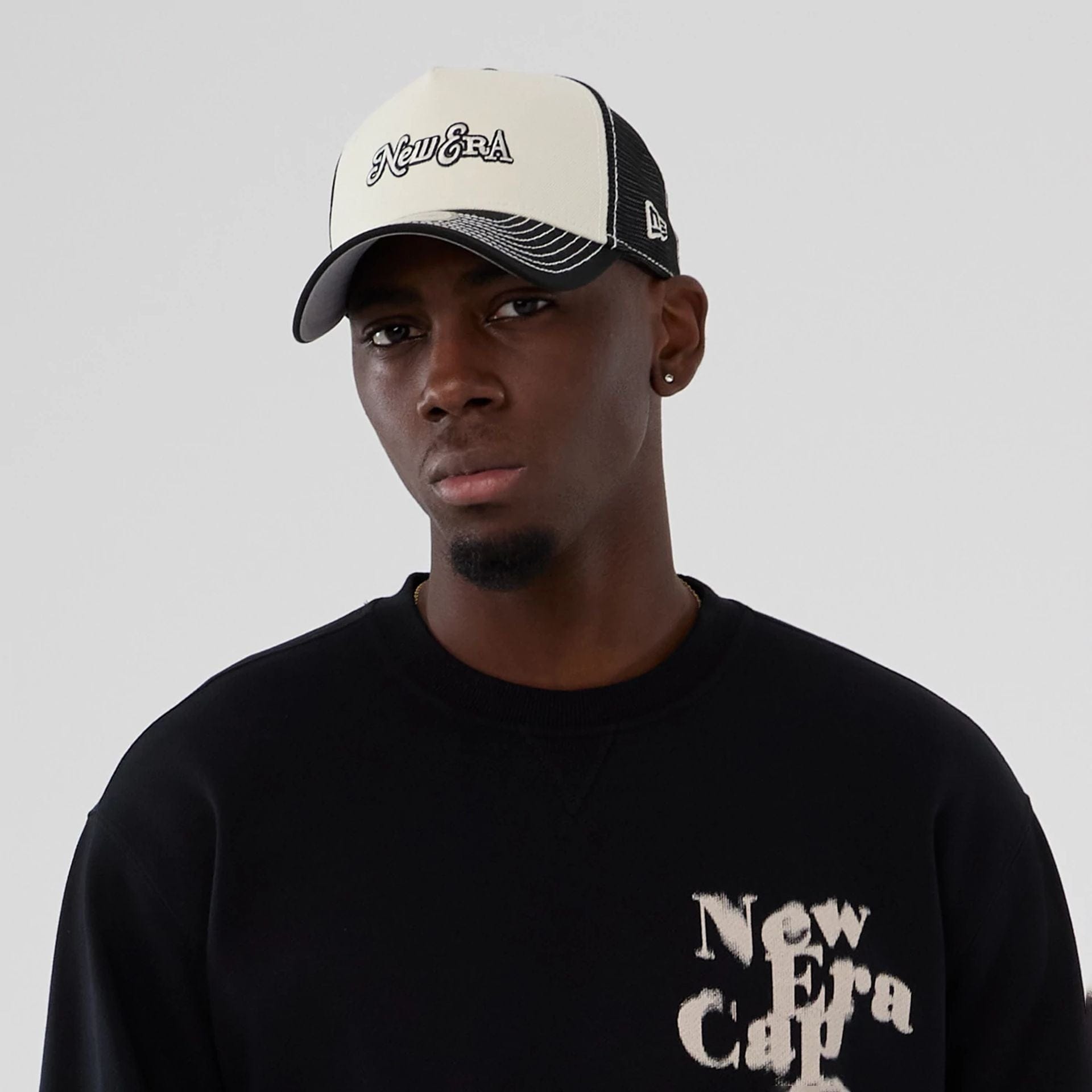 The Male model is wearing New Era Cap Company Black Crew Neck Sweater 6