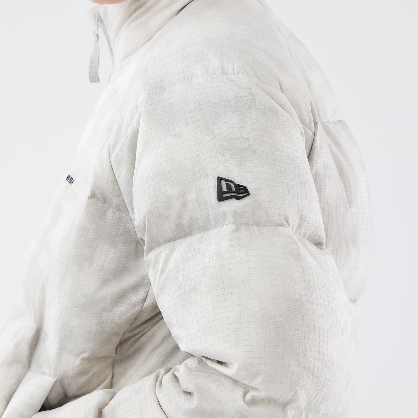 The Male model is wearing  New Era Outdoor Natural Down Jacket  5