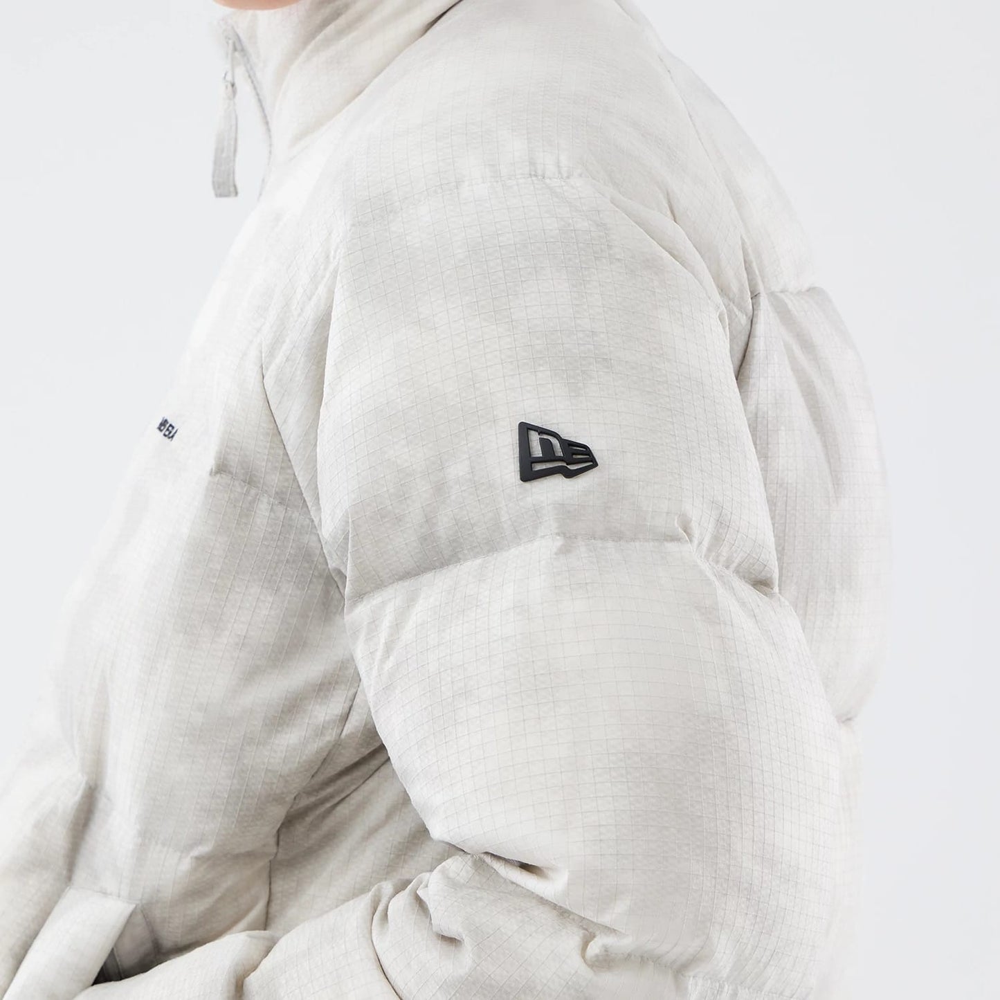 The Male model is wearing  New Era Outdoor Natural Down Jacket 5