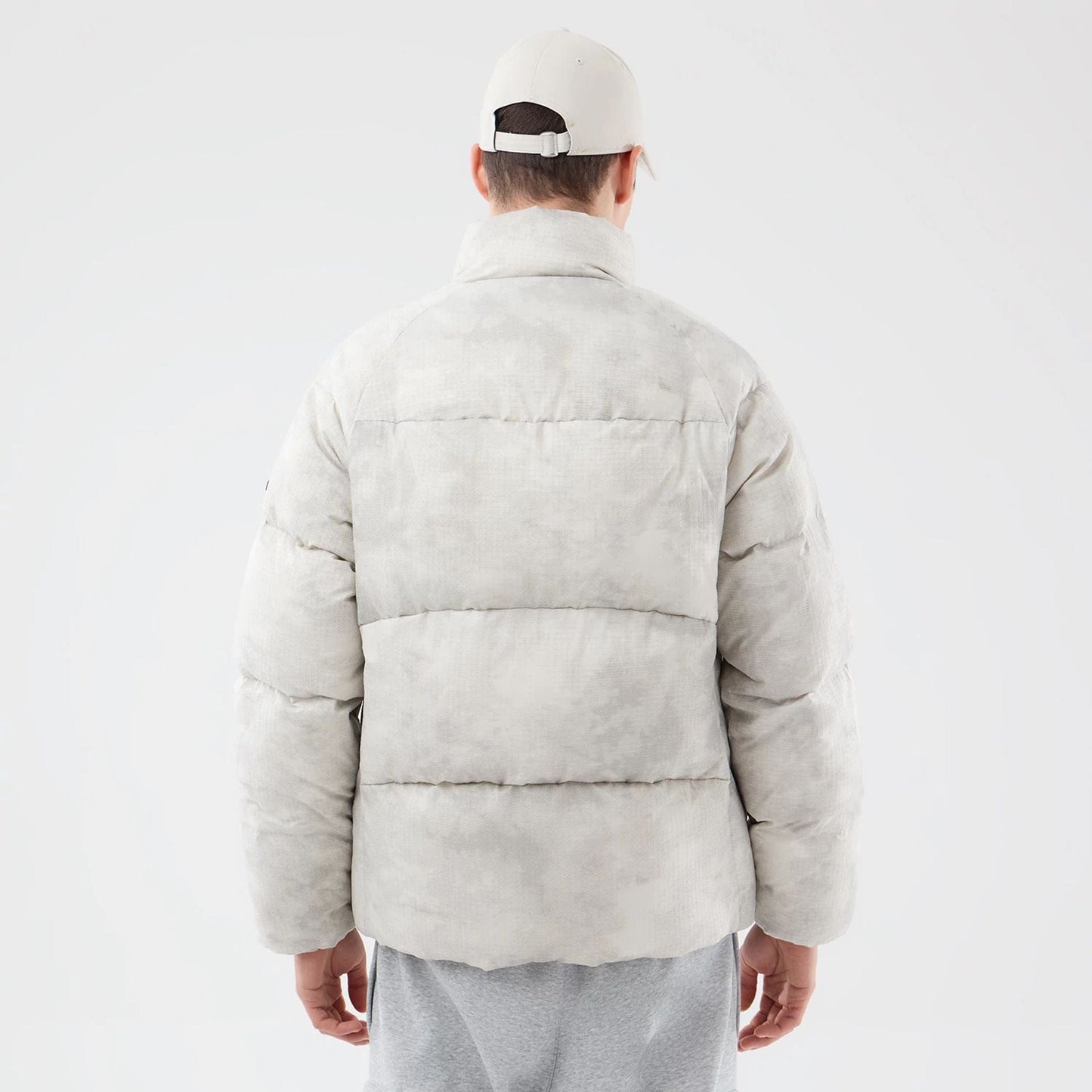 The Male model is wearing  New Era Outdoor Natural Down Jacket  2