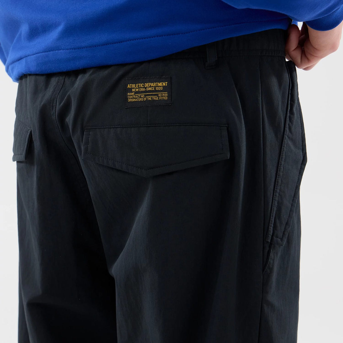 The Male model is wearing New Era Organic Black Parachute Trousers 5