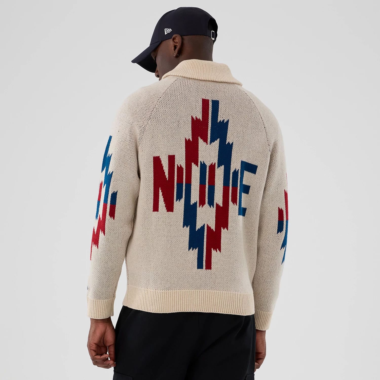 The Male model is wearing  New Era Organic Cowichan Natural Cardigan 2