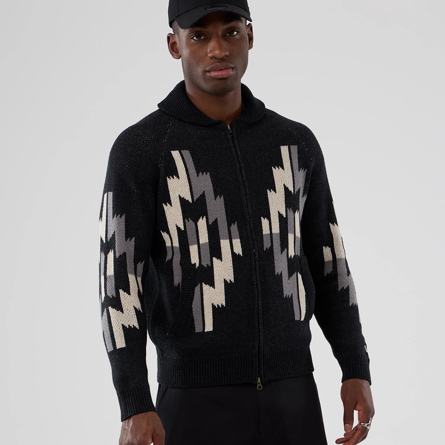 The Male model is wearing  New Era Organic Cowichan Black Cardigan 7