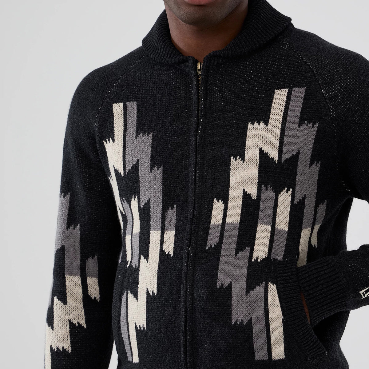 The Male model is wearing  New Era Organic Cowichan Black Cardigan 3