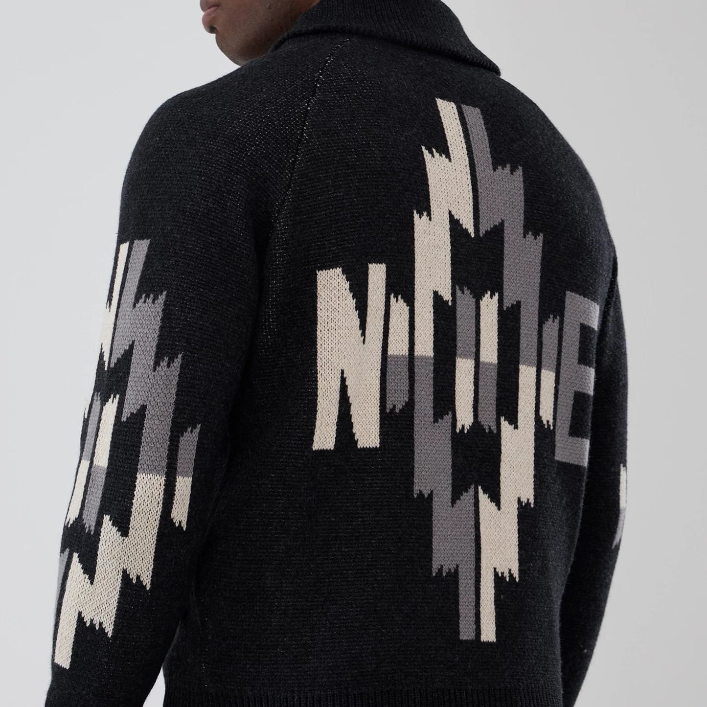 The Male model is wearing  New Era Organic Cowichan Black Cardigan 6
