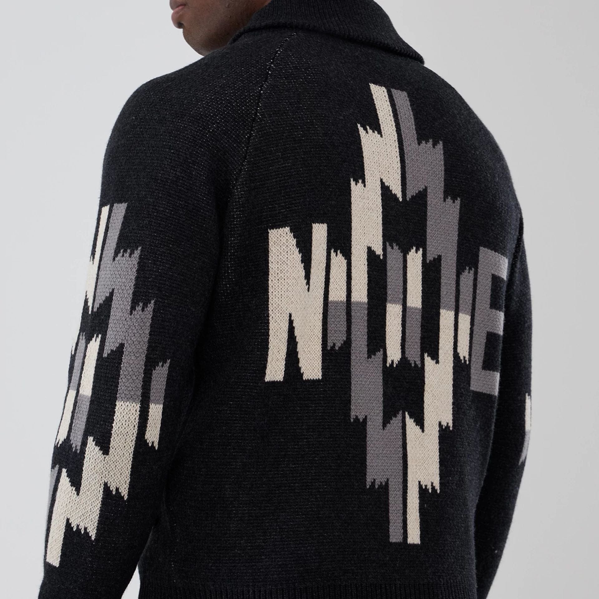 The Male model is wearing  New Era Organic Cowichan Black Cardigan  6