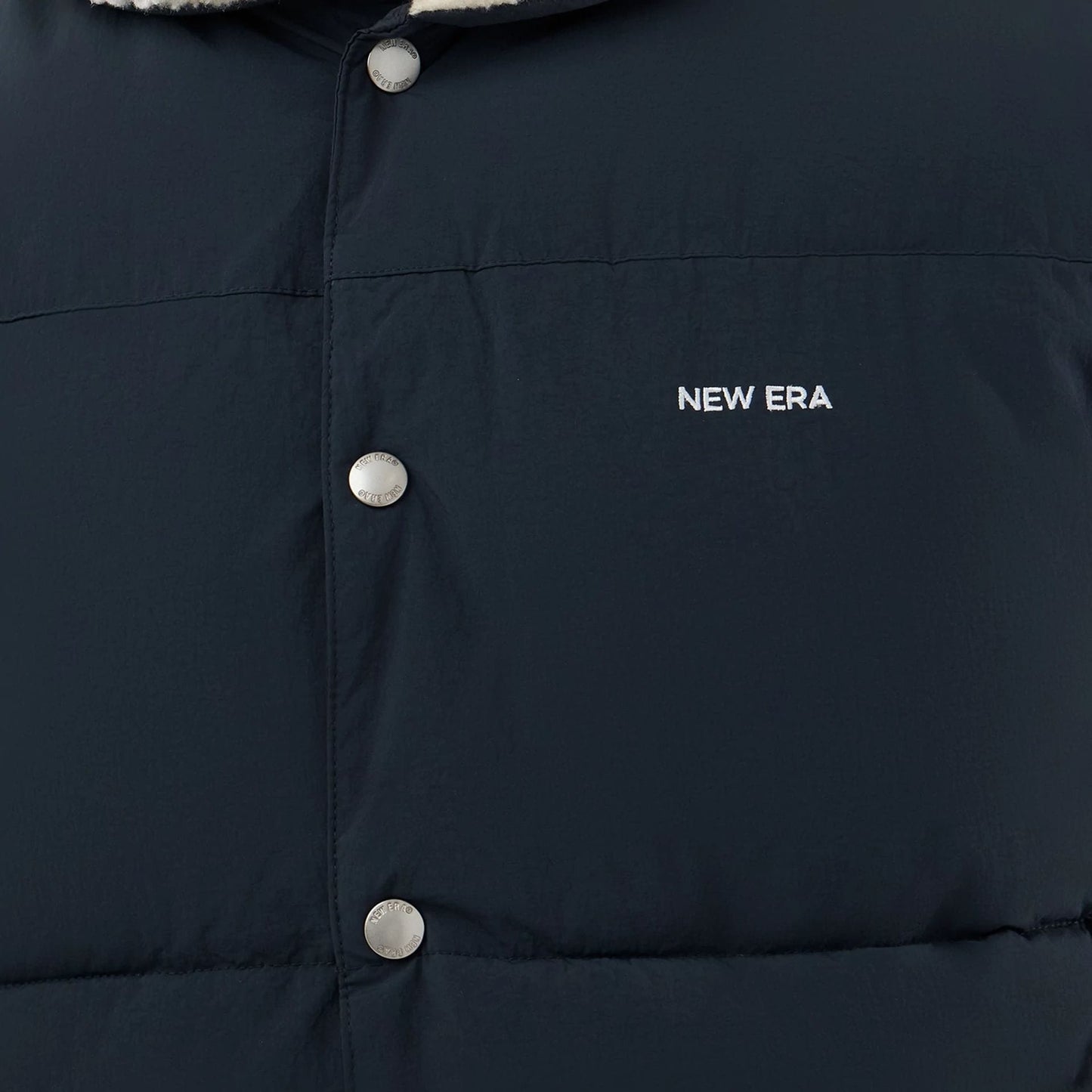 The Male model is wearing  New Era Organic Boa Neck Navy Gilet  6