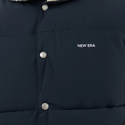 The Male model is wearing  New Era Organic Boa Neck Navy Gilet 6