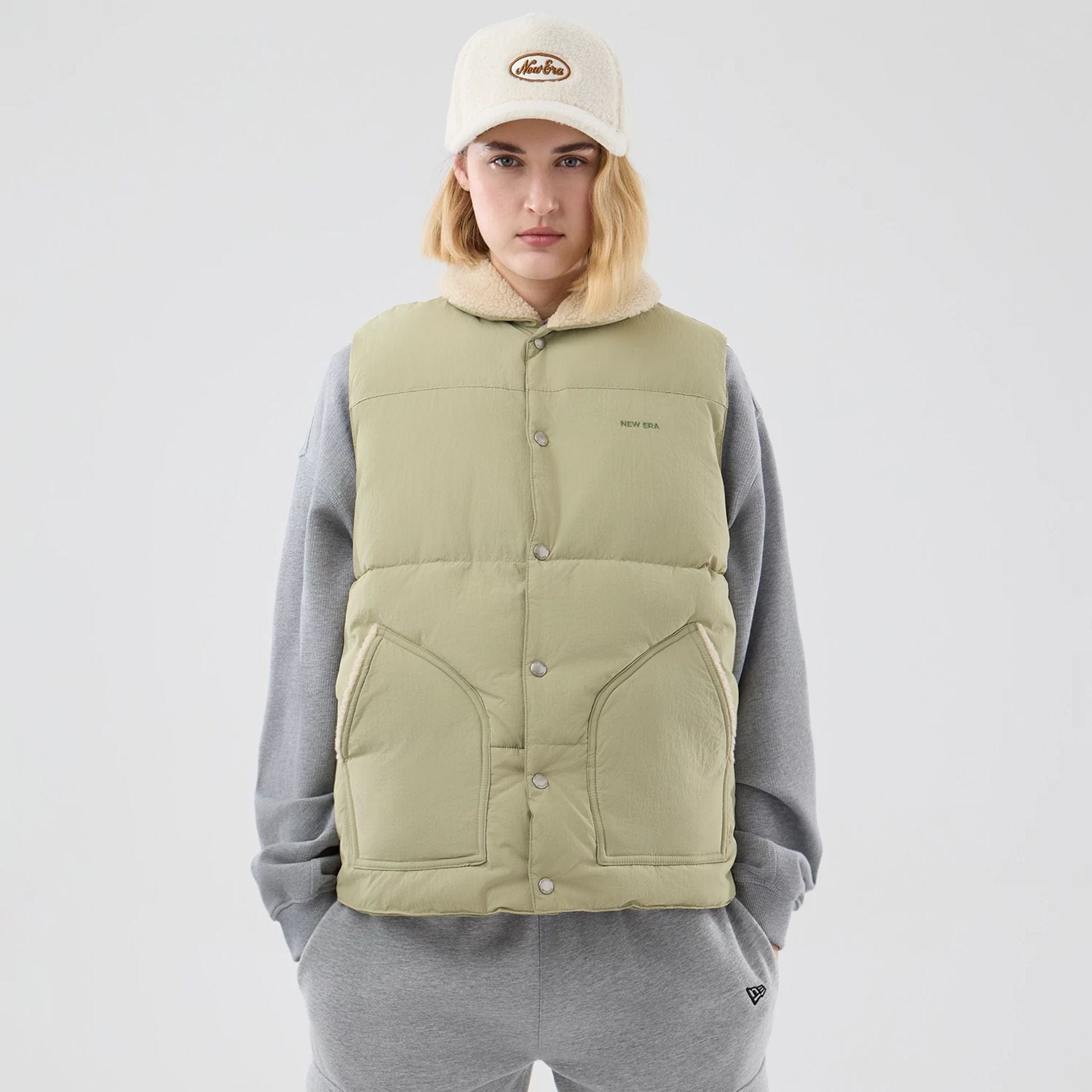 The Male model is wearing  New Era Organic Boa Neck Khaki Gilet  8