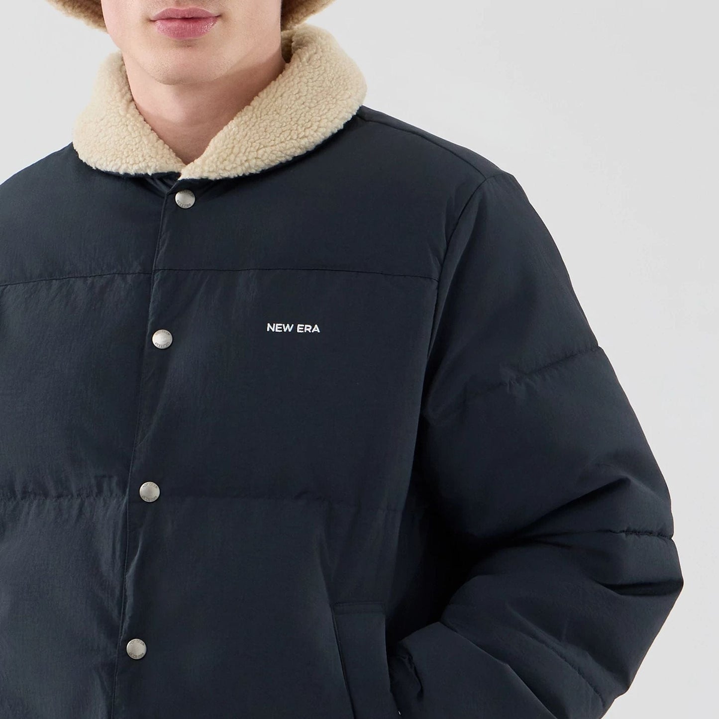 The Male model is wearing  New Era Organic Boa Neck Navy Jacket  5