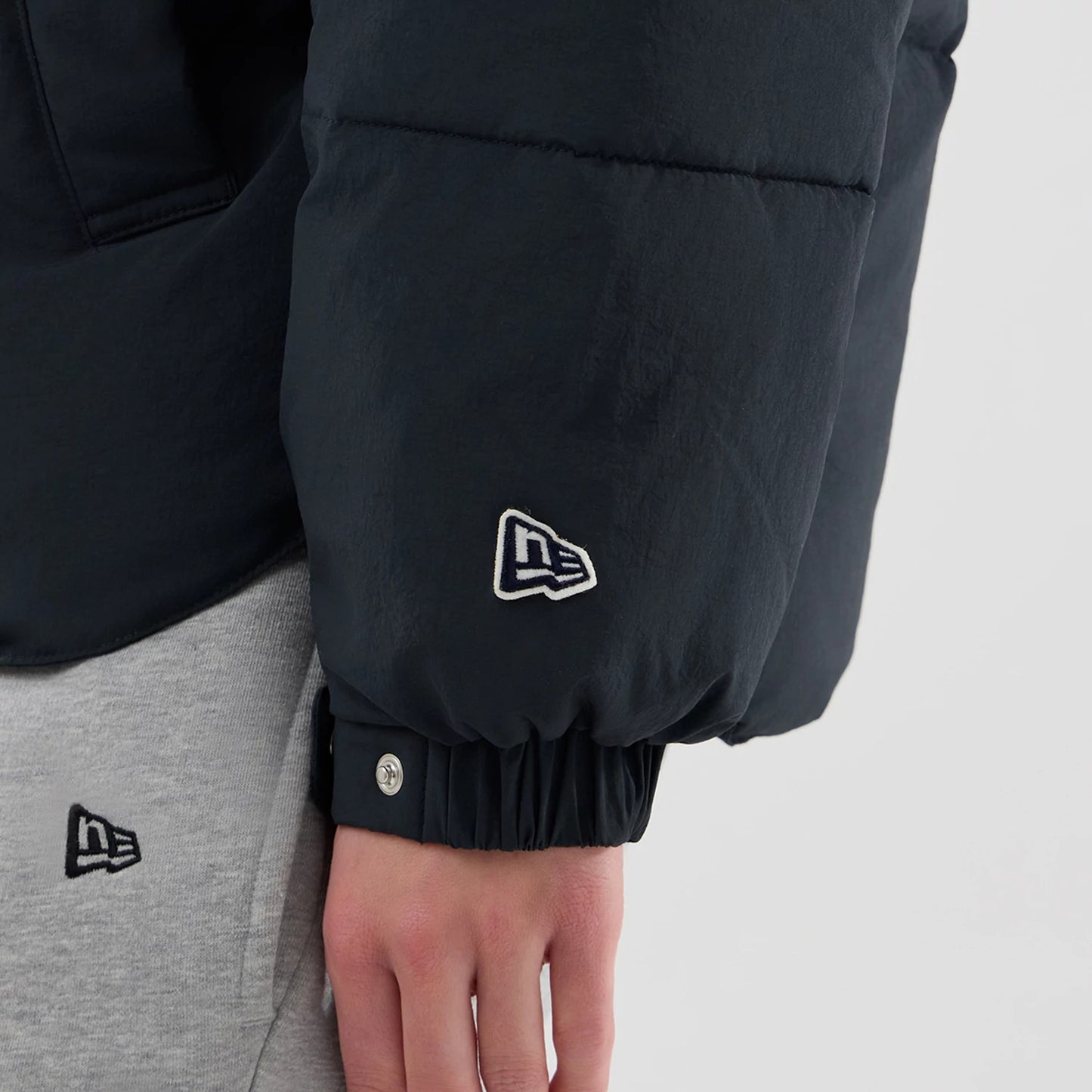 The Male model is wearing  New Era Organic Boa Neck Navy Jacket 7