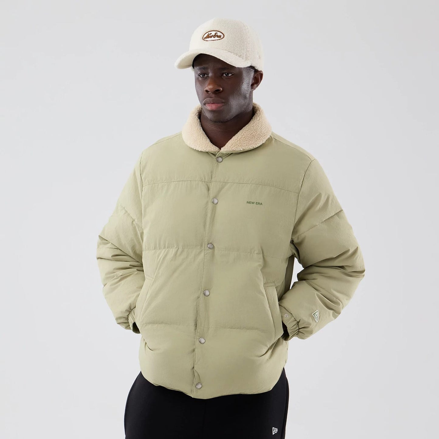 The Male model is wearing  New Era Organic Boa Neck Khaki Jacket 3