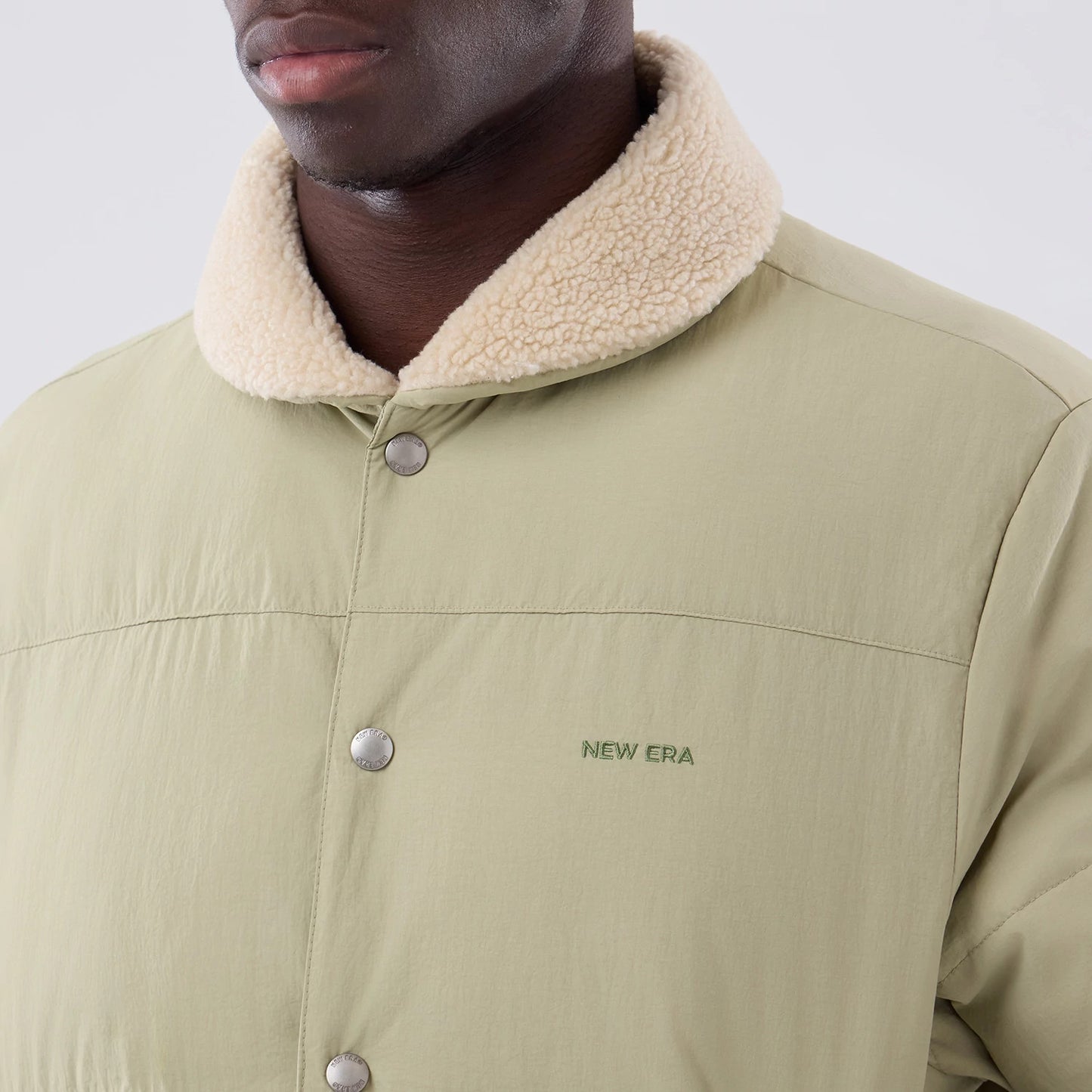The Male model is wearing  New Era Organic Boa Neck Khaki Jacket 5