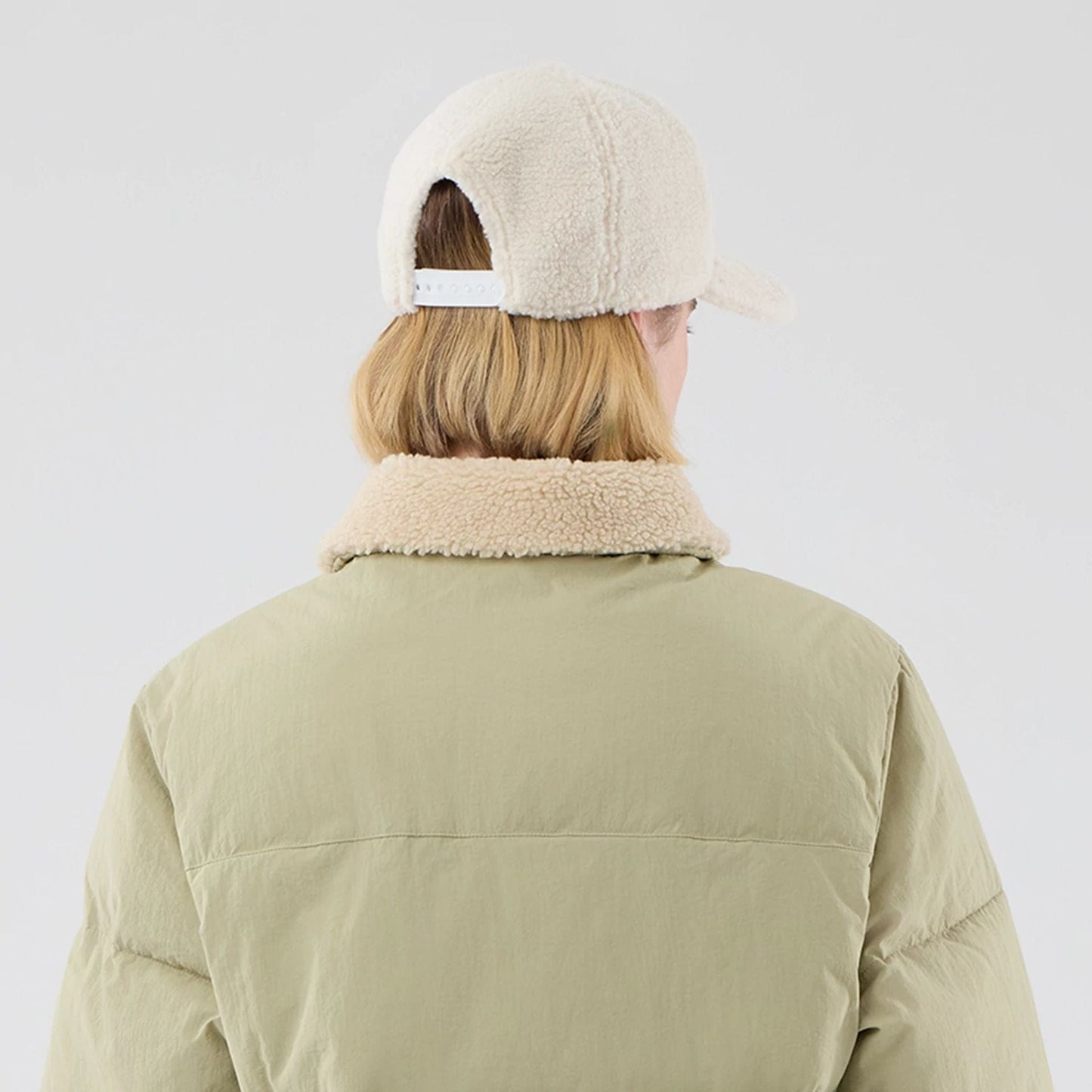 The Male model is wearing  New Era Organic Boa Neck Khaki Jacket  8