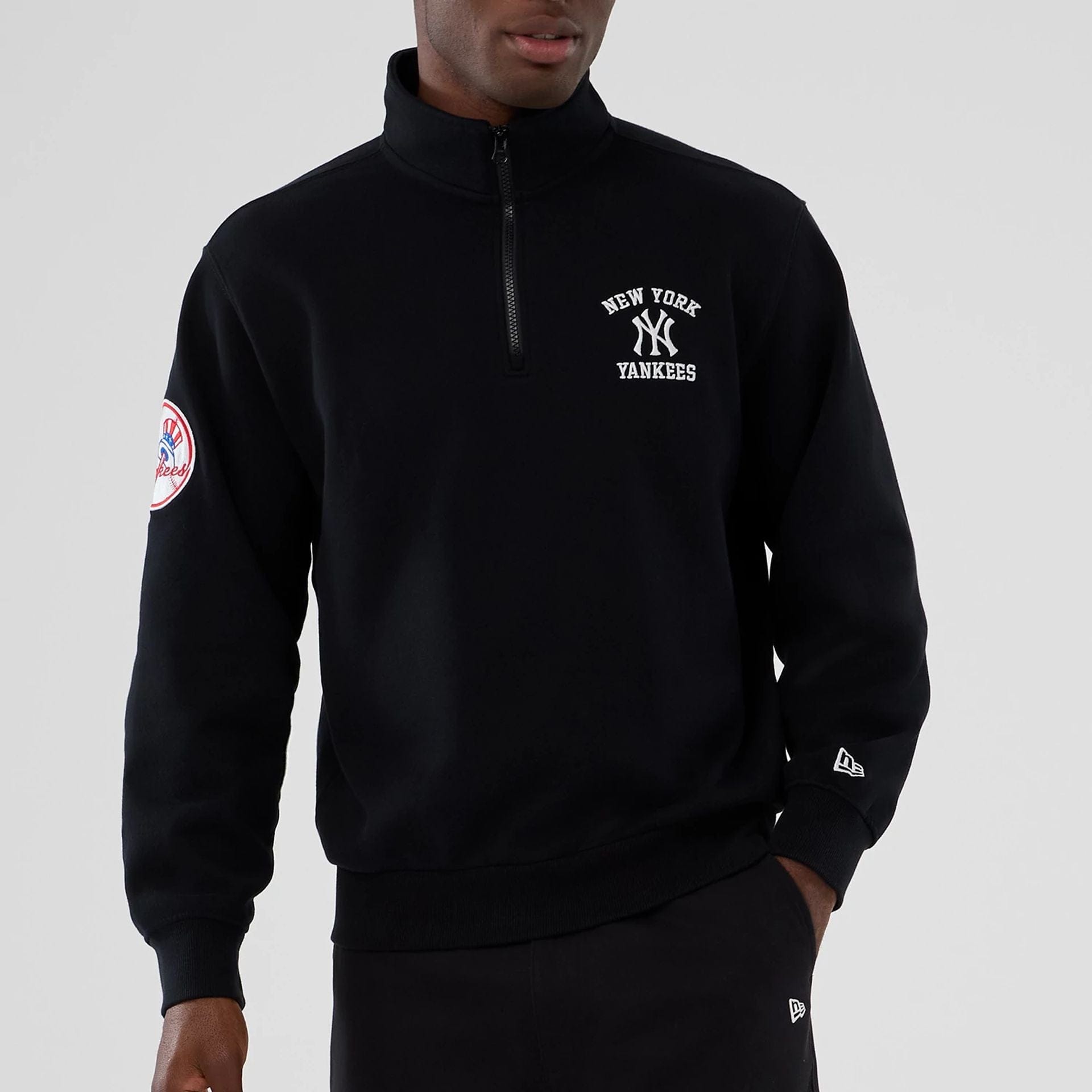 The Male model is wearing New York Yankees MLB Black 1/4 Zip Sweater 7