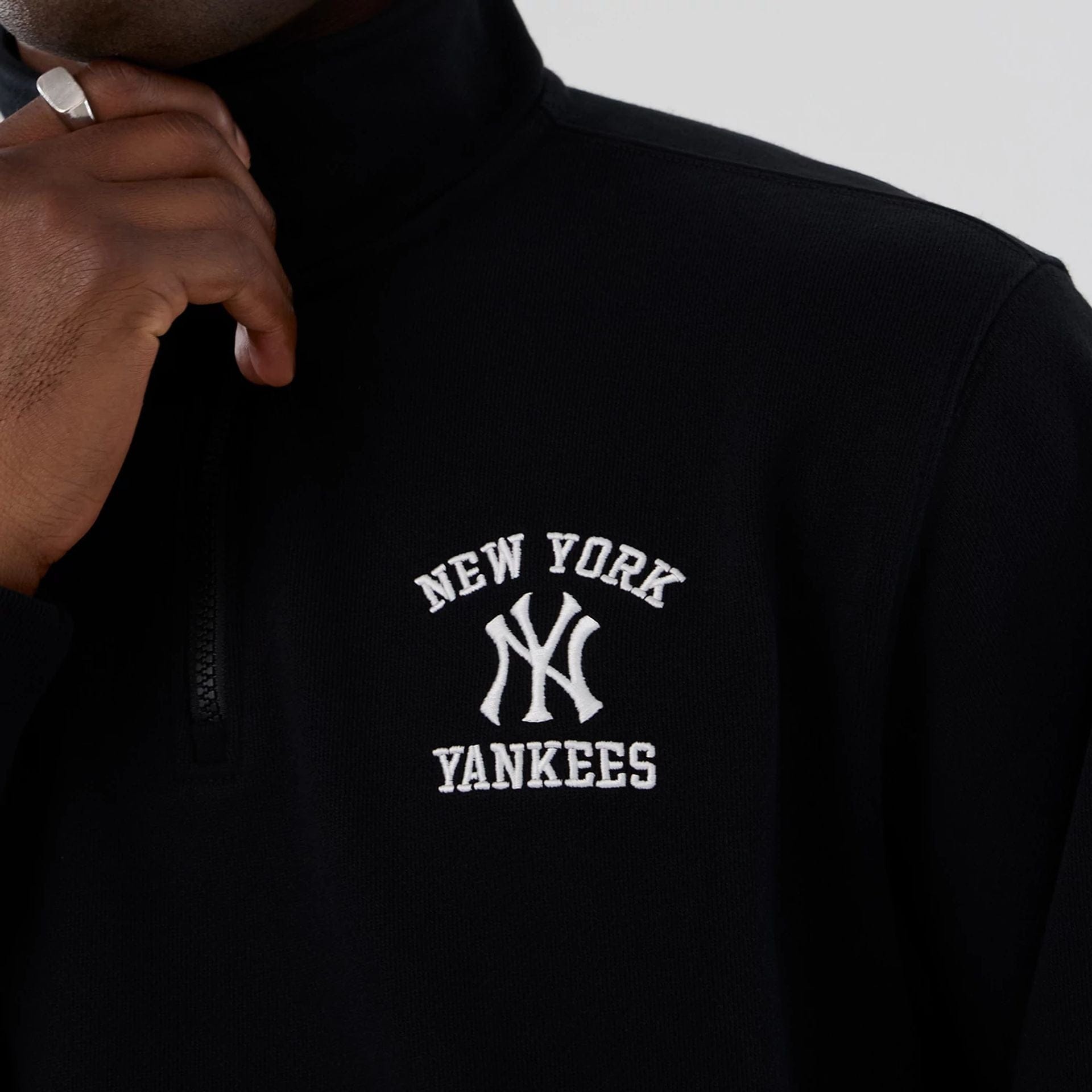 The Male model is wearing New York Yankees MLB Black 1/4 Zip Sweater 3