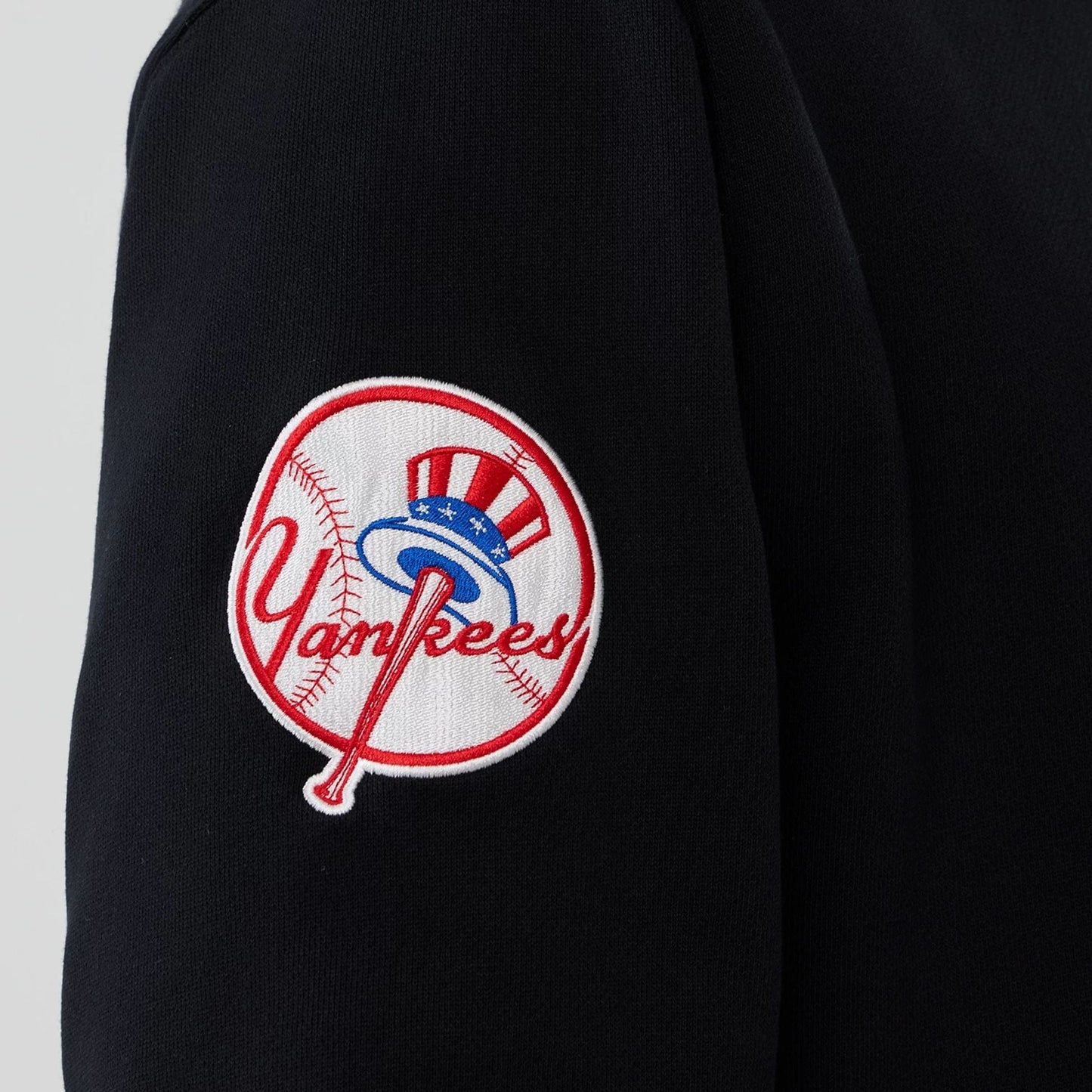 The Male model is wearing New York Yankees MLB Black 1/4 Zip Sweater 4