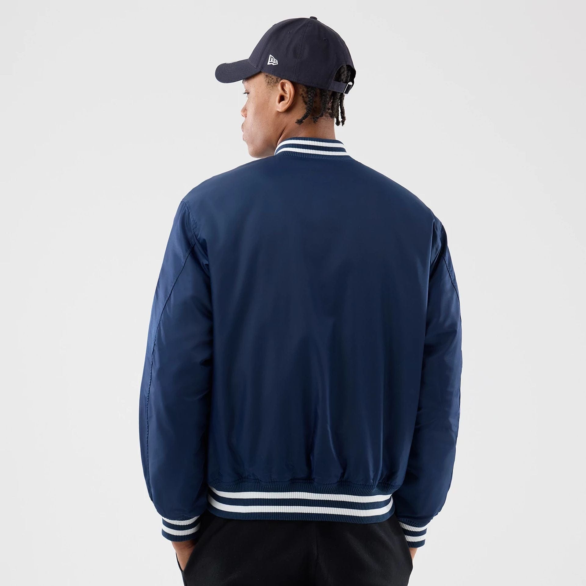 The Male model is wearing New York Yankees MLB Authentic Navy Stadium Jacket  2