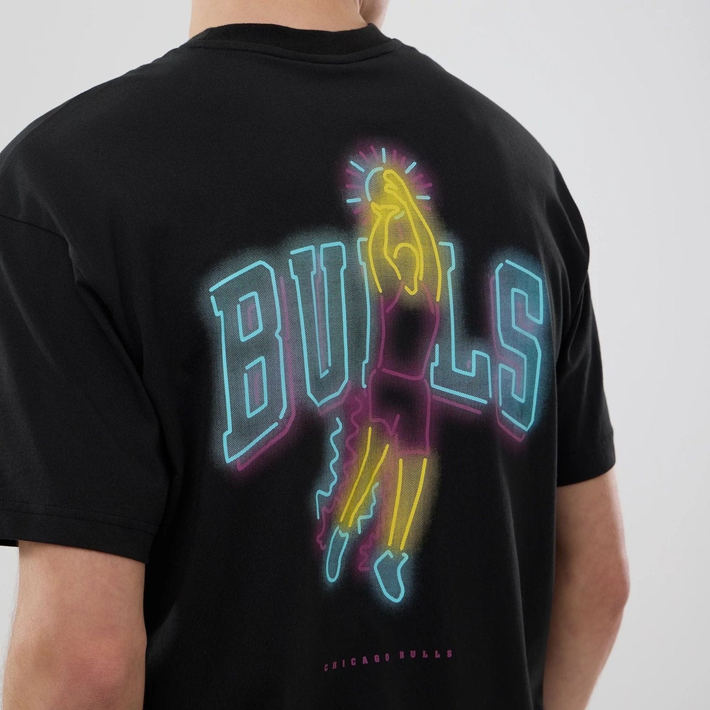 The model is wearing this NBA Neon Light Chicago Bulls T-Shirt in black. 6