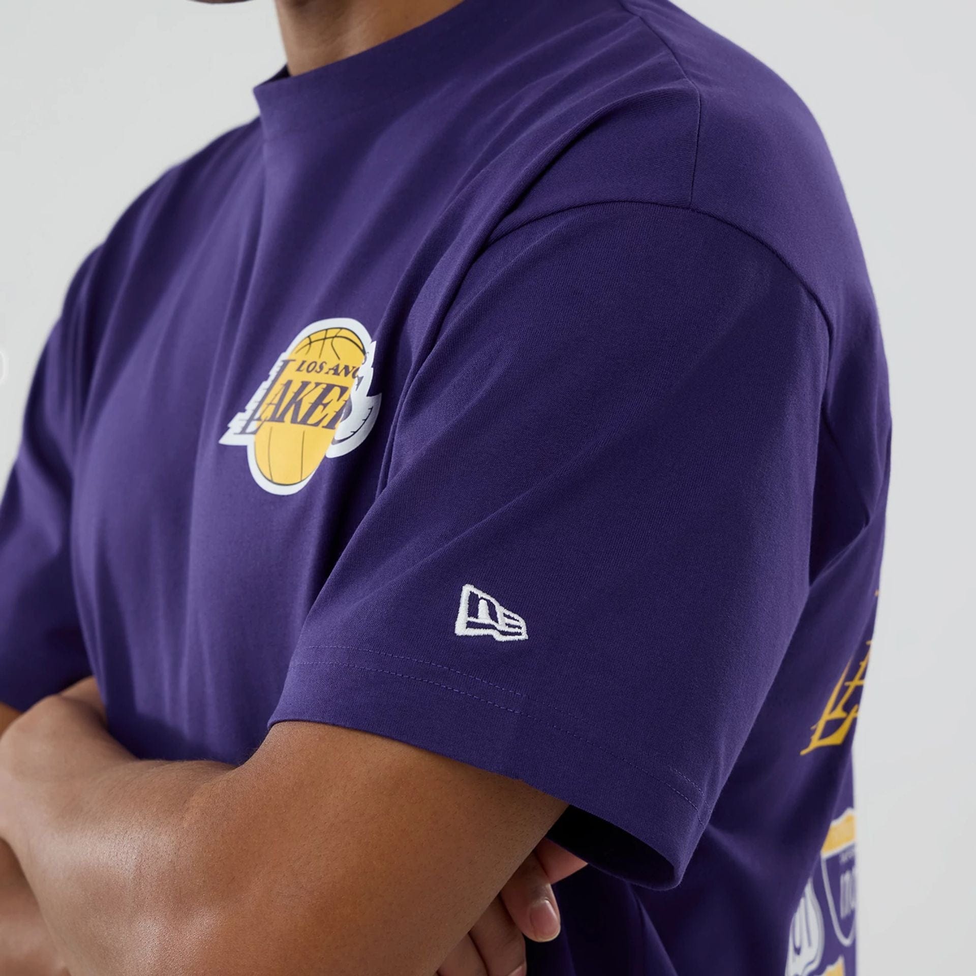 The model is wearing this NBA logo LA Lakers T-Shirt in purple. 5