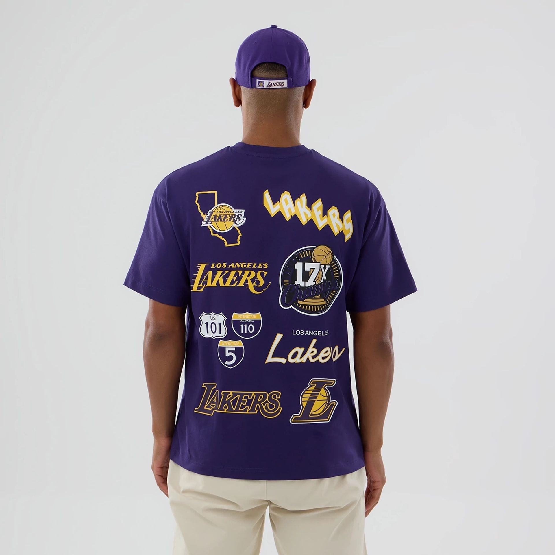 The model is wearing this NBA logo LA Lakers T-Shirt in purple. 2