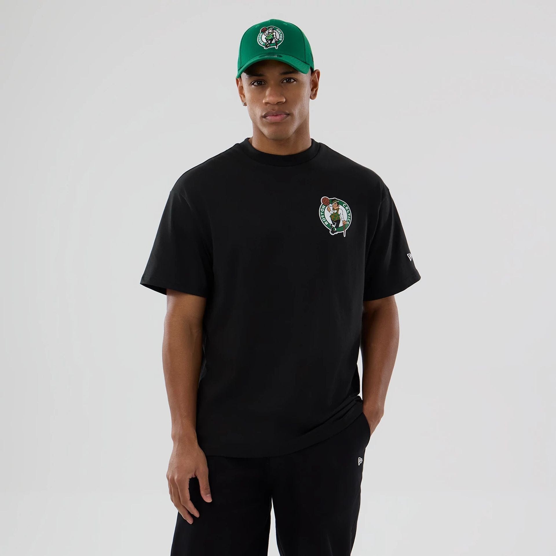 The model is wearing this NBA logo Boston Celtics T-Shirt in black. 1