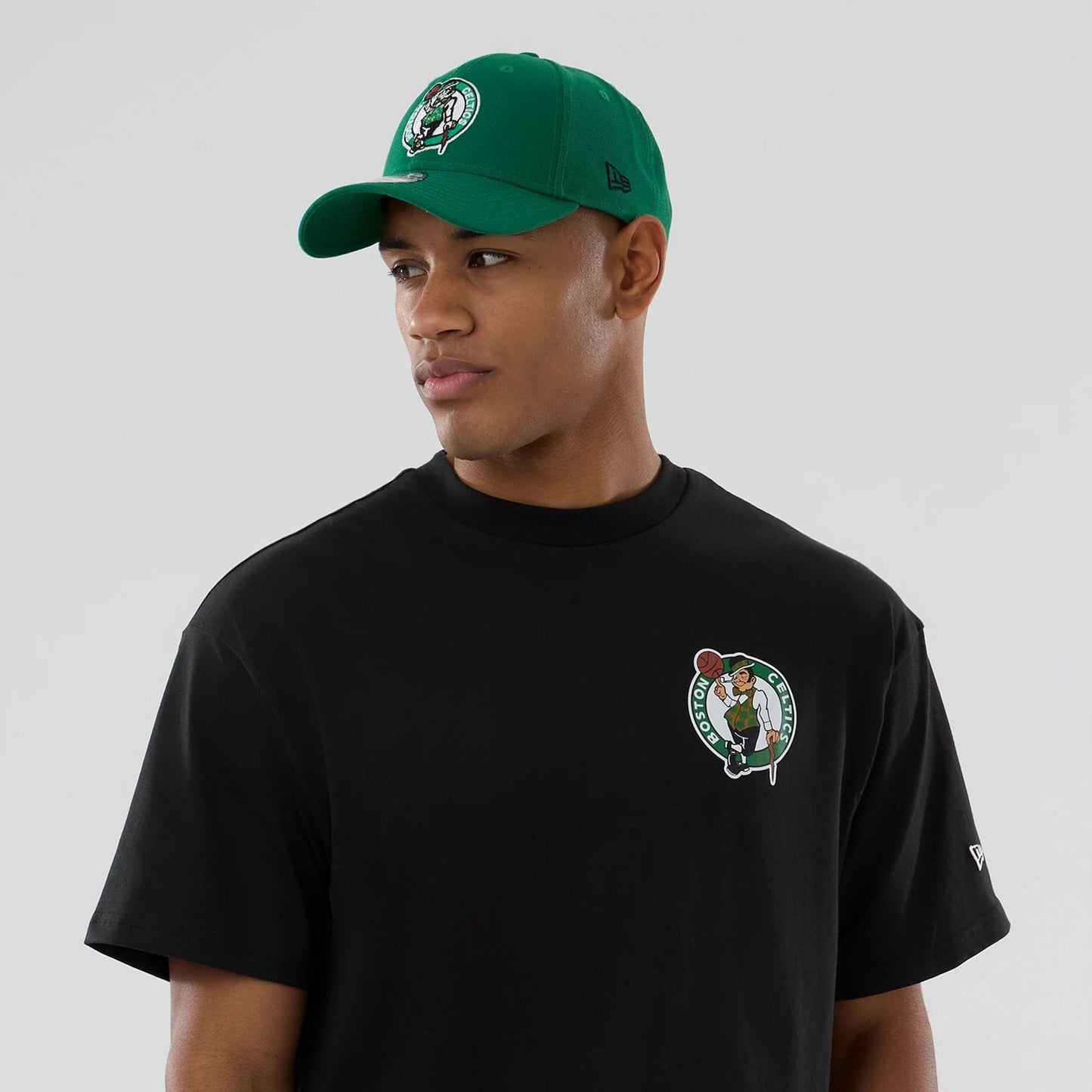 The model is wearing this NBA logo Boston Celtics T-Shirt in black. 6